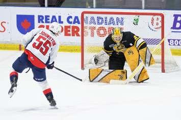 Sarnia Sting goaltender Anson Thornton makes a pad save on a penalty shot versus the Windsor Spitfires.  15 March 2022.  (Metcalfe Photography)