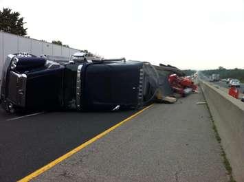 A transport truck is flipped over in the westbound lanes of Hwy, 401 near Dorchester on June 8, 2014. (Photo by Bob Becken)