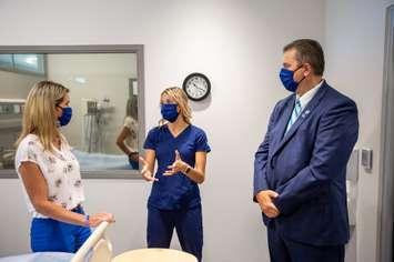 RPN and Lambton College student Courtney Cheswick speaking with MPP Jill Dunlop and Lambton College President and CEO Rob Kardas.  21 July 2021.  (Photo by Lambton College)