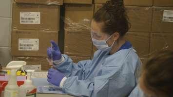 Pharmacy technician drawing up doses of COVID vaccine. (File photo by Colin Gowdy, Blackburn News)