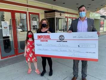 Imperial Theatre Executive Director Brian Austin presents a $317,200 cheque to the March 50/50 draw winner - Apr 7/21 (Photo courtesy of Brian Austin)