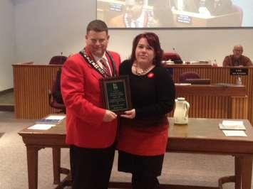 Lambton County Warden Todd Case presents Noelle's Gift Committee Member Jackie Major-Daaman with a plaque. November 5, 2014 (Blackburnnews.com photo by Jake Jeffrey)