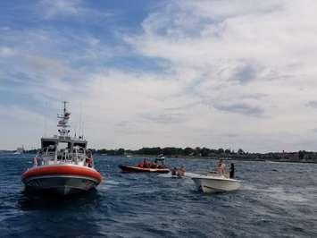 Point Edward Fire & Rescue and Canadian Coast Guard respond to overturned vessel July 9, 2017. Photo courtesy of Point Edward Fire & Rescue via Facebook.