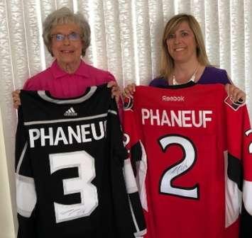 Wilma McNeill and Lesley Coene, St. Joseph’s Hospice Fund Development Coordinator, show off Dion Phaneuff raffle jerseys (submitted photo)