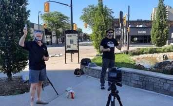 Sarnia Mayor Mike Bradley (left) with Sarnia bluegrass musician Mike Stevens filming a music video for Stevens' latest record, "Breathe In the World, Breathe Out Music", outside Sarnia City Hall. July 2020. (Photo from Bradley's Twitter)
