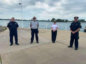 CBSA Operations Chief Rob Long, RCMP Cst. Ian Smith, Coast Guard Deputy Superintendent Kathleen Getty and Sarnia Police Deputy Chief Owen Lockhart discuss plans for the 2020 Port Huron Float Down. August 14, 2020 Photo by Melanie Irwin 