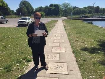 Sexual Assault Survivors Centre Executive Director Michelle Batty speaks to those gathered on the Footsteps Tribute to Courage Walkway. June 21, 2016 (BlackburnNews.com photo by Melanie Irwin)
