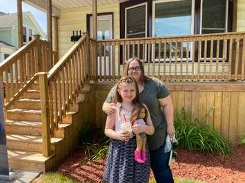 Kelly Edwards and her daughter Piper in front of their new Habitat for Humanity home on Bright Street in Sarnia. June 26, 2020 Photo by Melanie Irwin