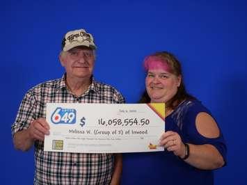 Melissa and John Wright of Inwood with a OLG cheque for over $16-million. (Photo by OLG)