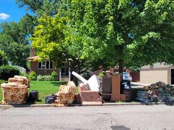 Flood damaged items put to the curb for pickup in Sarnia's Coronation Park area. August 10, 2022. Sarnia News Today photo by Stephanie Chaves. 