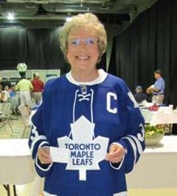 Wilma McNeill wears an autographed Dion Phaneuf jersey in 2013. Blackburnnews.com file photo.