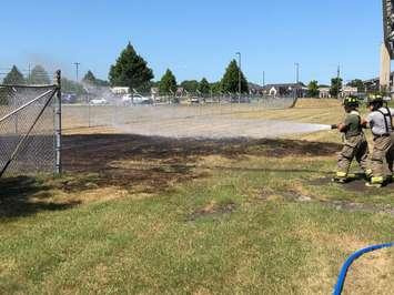 Point Edward firefighters douse grass fire at Blue Water Bridge Aug. 9, 2019 (Photo courtesy of Point Edward Fire & Rescue via Facebook)