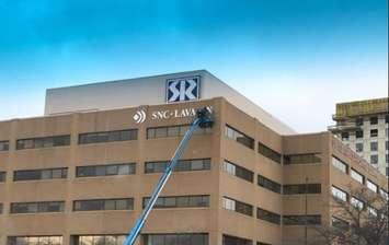 The SNC Lavalin sign being taken down at the St. Clair Corporate Centre in Sarnia (Photo courtesy of Kentech)