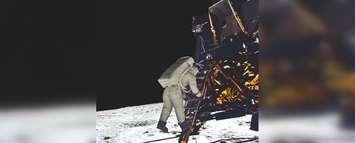 Astronaut Buzz Aldrin prepares to step from the lunar lander onto the moon July 20, 1969 (Photo courtesy of NASA)