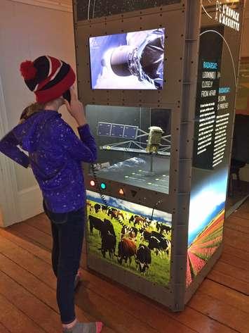 A visitor to the St. Marys Museum checks out a display as part of the "Space to Spoon" exhibit. Photo courtesy of the St. Marys Museum.