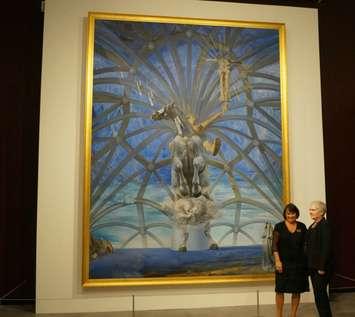 Lambton County Warden Bev MacDougall and JNAAG Curator Lisa Daniels stand in front of a piece from Salvador Dali. Photo by Jake Jeffrey Sept 30, 2015. (blackburnnews.com) 