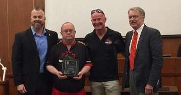 Wes Harding from Team Hoyt Canada stands beside Mayor Mike Bradley (far right) to receive his award. October 2, 2017 (Photo by Melanie Irwin)
