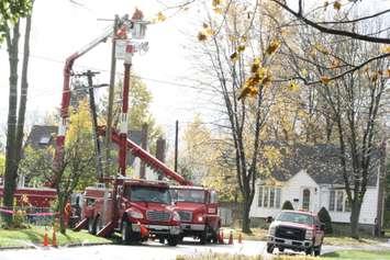 Hydro crews replace a broken pole Sat. Nov 1, 2014 in the aftermath of very strong winds.  (BlackburnNews.com photo by Dave Dentinger)