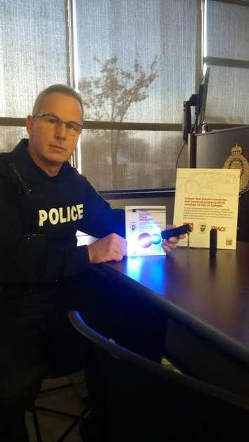 Sarnia police Constable Chris Moxley displays Trace Pen technology. January 15, 2015 (Submitted photo.)