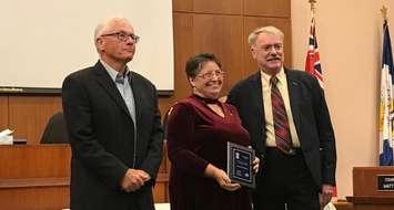 Yvonne McInnes accepts a 2018 Accessibility Award from councillor Mike Kelch (left) and Mayor Mike Bradley (right). October 1, 2018 Photo by Melanie Irwin