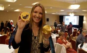 Heather Moyse holds her two Olympic gold medals during an event in Point Edward. February 7, 2019. (Photo by Colin Gowdy, BlackburnNews)