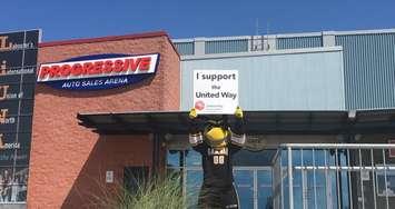 Sarnia Sting mascot holding a United Way of Sarnia-Lambton sign outside Progressive Auto Sales Arena.  (Photo by Sarnia Sting)