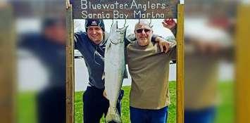 Robert Brunet (right) next to a 19.01 lb. salmon caught in the 2019 Salmon Derby. May 4 2019. (Photo by Bluewater Anglers)