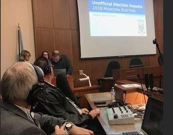 Blackburn Radio News Manager Dave Dentinger takes note of the time as Sarnia staff work to release election results. October 22, 2018 Photo by Melanie Irwin