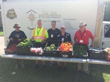 Volunteers & staff at The Inn's Mobile Market visit 14 locations every week throughout Sarnia-Lambton distributing fresh produce.  (Photo courtesy of Myles Vanni)