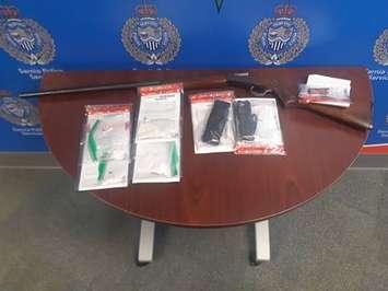 A shotgun and tasers seized from an Exmouth Street residence - Nov 12/20 (Photo courtesy of Sarnia Police Service)