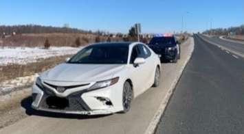 Lambton OPP conducting a traffic stop after a vehicle was clocked at over 150 km/h in the 110 km/h zone on Highway 402. (Photo by Lambton OPP)
