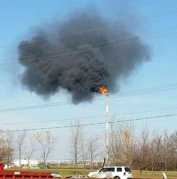 Flames and black smoke spew from a Plains Midstream stack Nov. 15, 2016 (Photo courtesy of Greg Groulx)