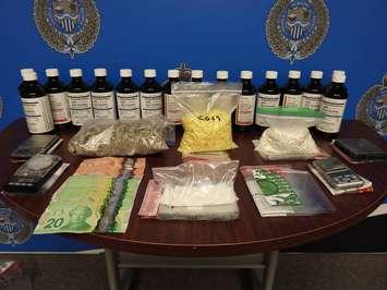 Cash, drugs and drug paraphernalia seized by Sarnia Police. 
 May 2022.  (Photo by Sarnia Police Service)