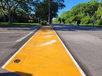 An orange crosswalk at to honour Indigenous children lost to residential schools, located at Christina Street and Cathcart Boulevard in Sarnia. June 2022.  (Photo by SarniaNewsToday.ca)
