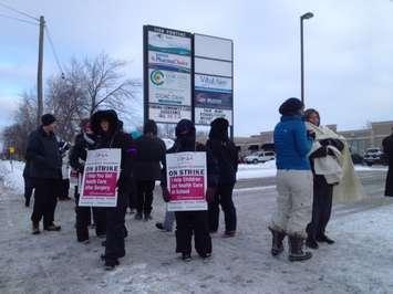 Picketers brave frigid temperatures at the CCAC on Pontiac Dr. Jan. 30, 2015
(BlackburnNews.com photo by Dave Dentinger)