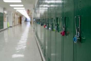 A row of lockers inside a school. File photo courtesy of © Can Stock Photo / kenhurst.