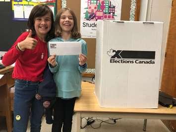 King George VI Grade 4/5 students (left to right) Nancy Williams and Meghan Lambert show they're excited to vote in a mock municipal election. October 21, 2022 Image courtesy of Susan Shaw.
