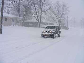 A Jeep driving through snowy conditions. December 19, 2008. (Photo by Michael Mol from Flickr)